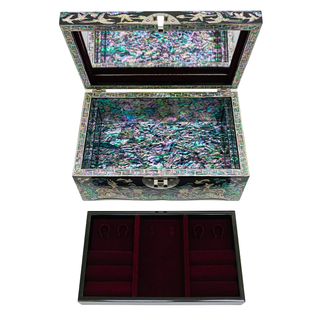 A stunning Mother of Pearl jewelry box featuring detailed bird and floral designs. The shimmering exterior opens to reveal a captivating iridescent interior.