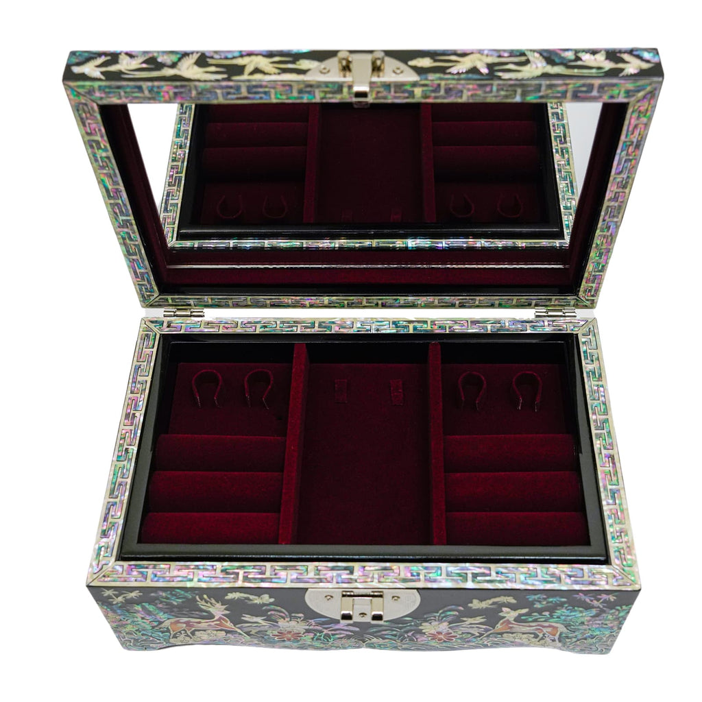 An exquisite Mother of Pearl jewelry box with intricate bird and floral motifs. The exterior contrasts with a plush red interior for organized storage. Features a hinged lid and secure clasps to keep treasures safe.
